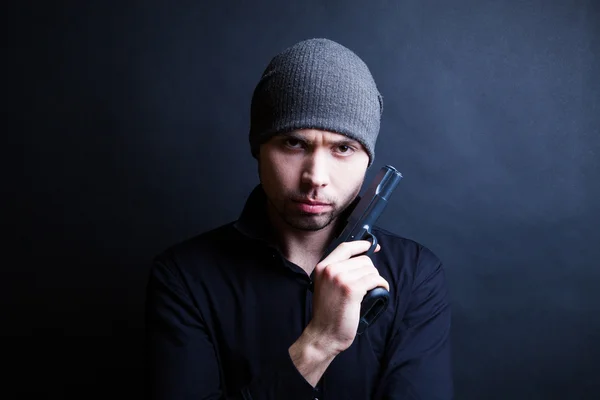 Portrait of a man holding gun — Stock Photo, Image