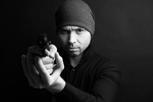 Portrait of a man holding gun