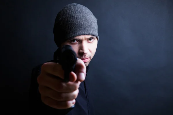 Portrait of a man holding gun — Stock Photo, Image