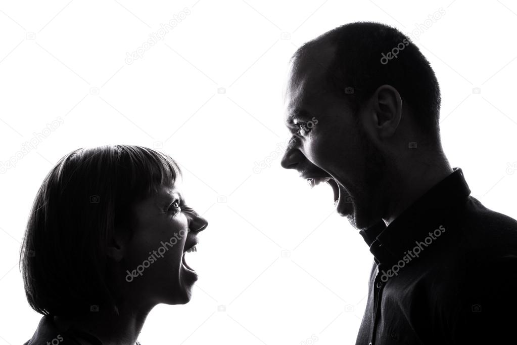One caucasian couple man and woman face to face screaming shouting dipute in studio silhouette
