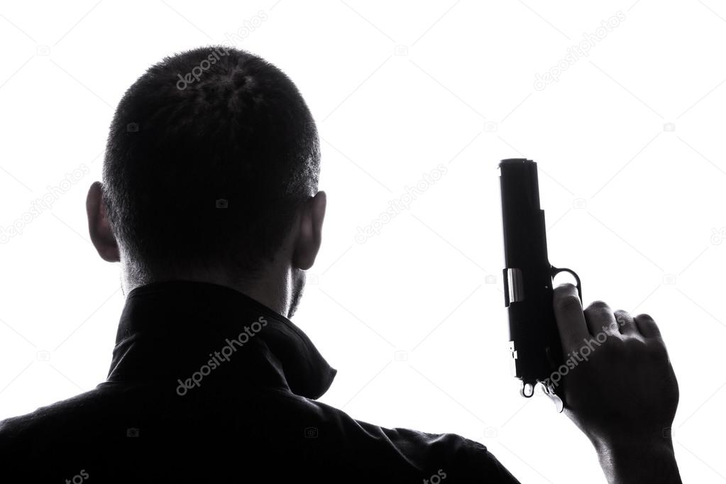 One caucasian man holding gun portrait silhouette