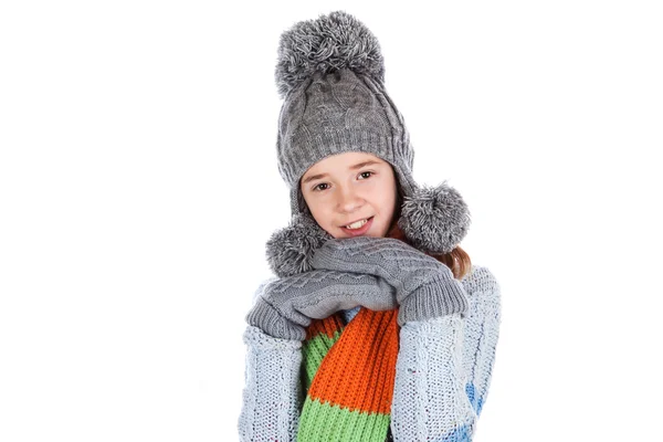 Beautiful little girl in cap and scarf — Stock Photo, Image