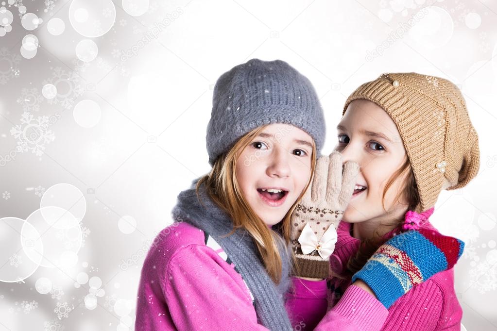 Two little girls in Christmas background