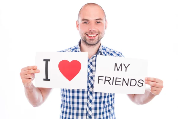 Happy young man with sign — Stock Photo, Image