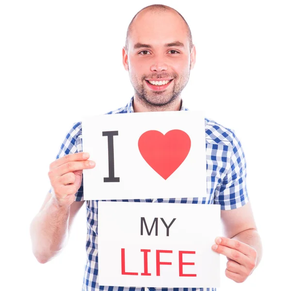 Happy young man with sign — Stock Photo, Image