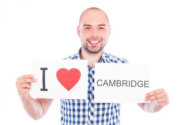 Mann mit Ortsschild Cambridge. — Stockfoto