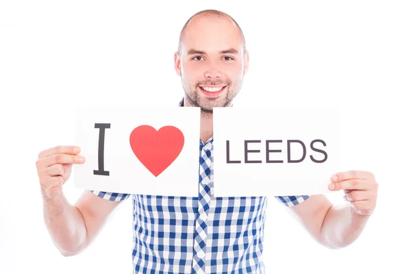 Man with city sign Leeds. — Stock Photo, Image