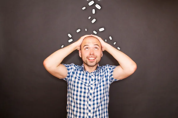 Man in coin rain — Stock Photo, Image