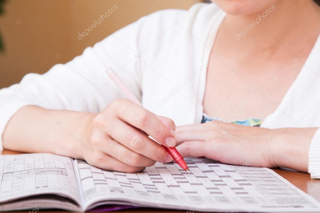 Woman doing crosswords