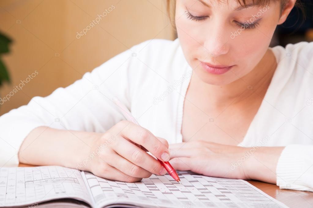Woman doing crosswords