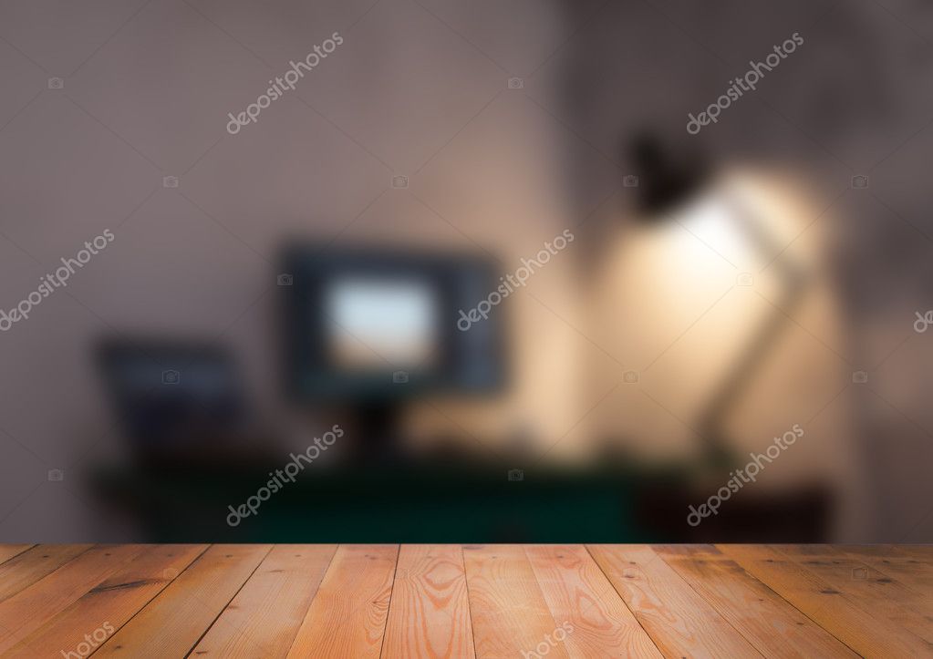 Blurred interior of room with wooden surface