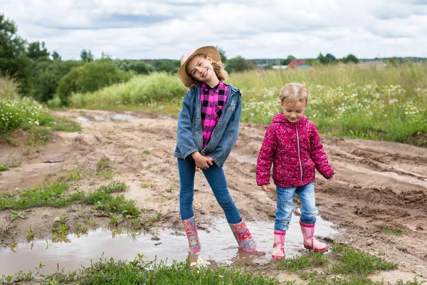 Two Smiling Girls Run Puddles Play — Photo
