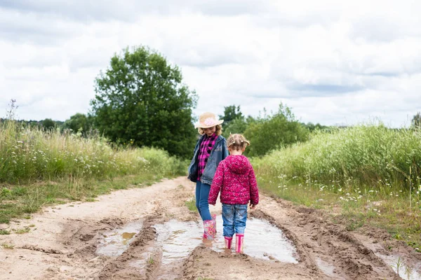 Two Smiling Girls Run Puddles Play — Photo