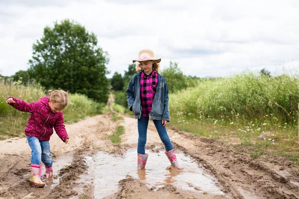 Two Smiling Girls Run Puddles Play — Stock Photo, Image