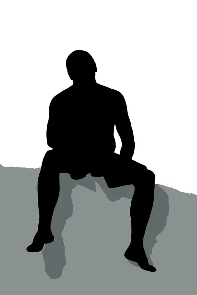 Silhueta de um homem sentado no topo de uma montanha — Fotografia de Stock