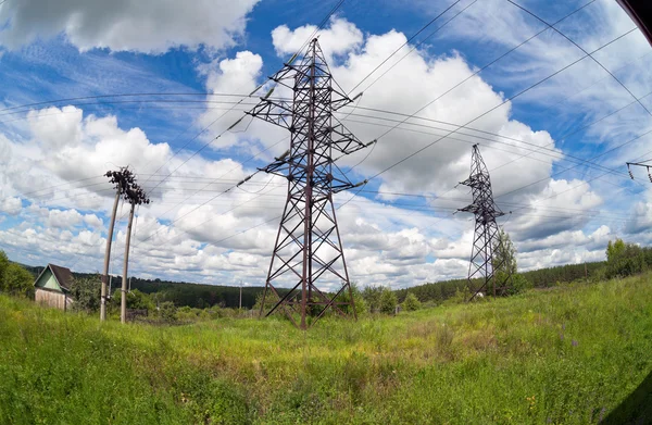 Electric power lines on a blue sky background and clouds. Fishey — Stock Photo, Image