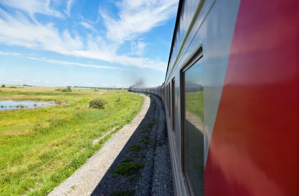 Train goes by rail in summer day, countryside. — Stock Photo, Image