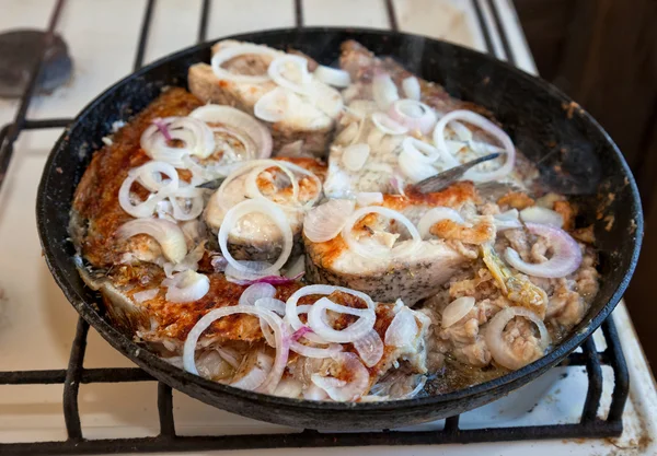 Fried fish in a frying pan — Stock Photo, Image