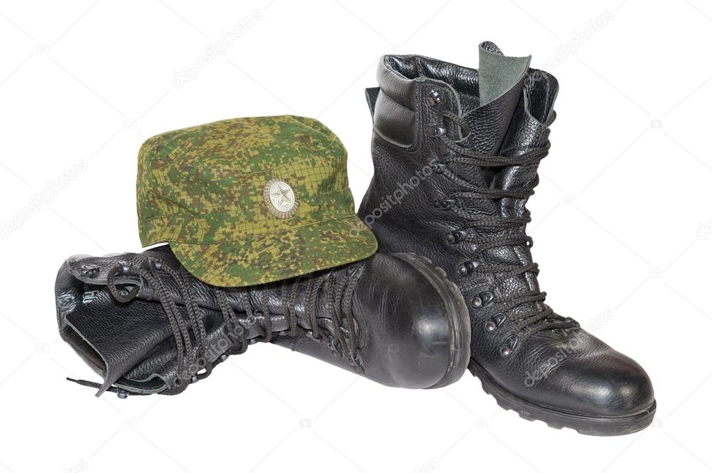 Army boots and cap isolated on white