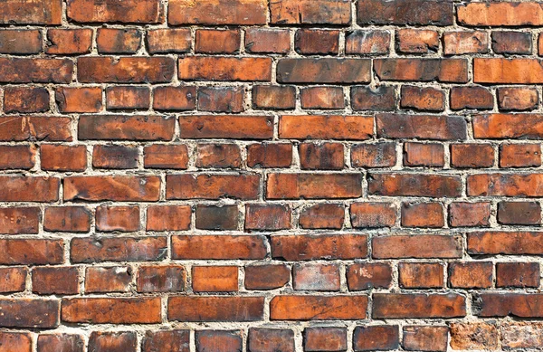 Old weathered red brick wall as background — Stock Photo, Image