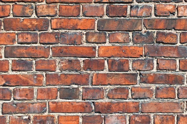 Old weathered red brick wall as background — Stock Photo, Image