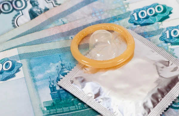 Condom on the russian rubles bills — Stock Photo, Image