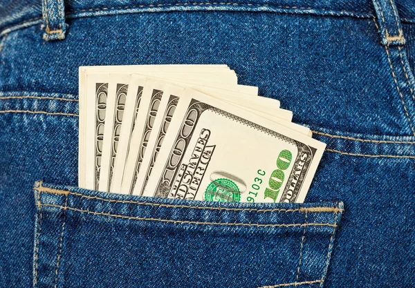 バックジーンズのポケットに米ドル — ストック写真