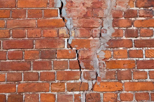 Old weathered red brick wall as background — Stock Photo, Image