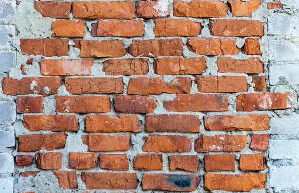 Oude verweerde grunge bakstenen muur als achtergrond — Stockfoto