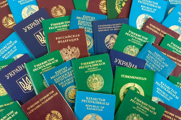 Different foreign passports as background — Stock Photo, Image