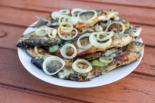 Fried fish on a plate — Stock Photo, Image