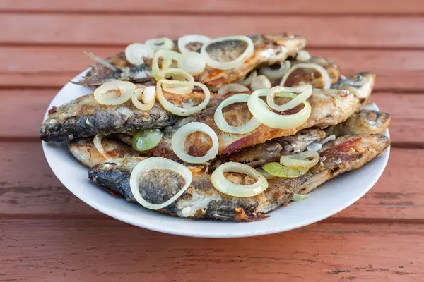 Fried fish on a plate — Stock Photo, Image