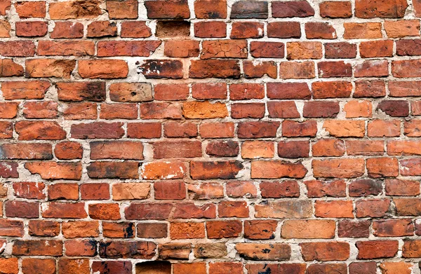 Oude verweerde grunge rode bakstenen muur als achtergrond — Stockfoto