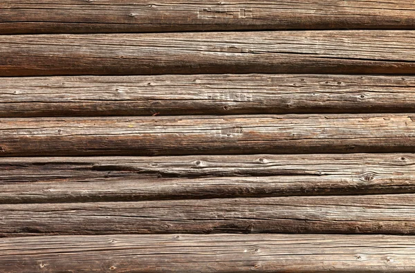 Bûches de bois mur de vieux fond de maison rurale — Photo