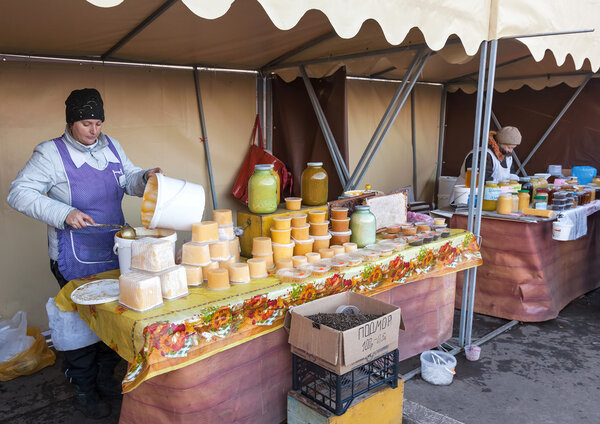 SAMARA, RUSSIA - OCTOBER 20: Women seller of honey on the tradit
