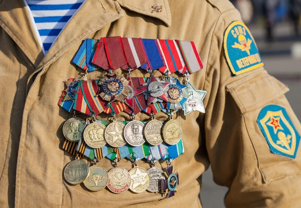 Numerous military awards and medals on the uniform of veteran sp — Stock Photo, Image