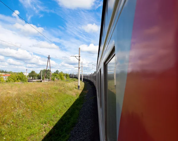 Train goes by rail in summer day, countryside. — Stock Photo, Image