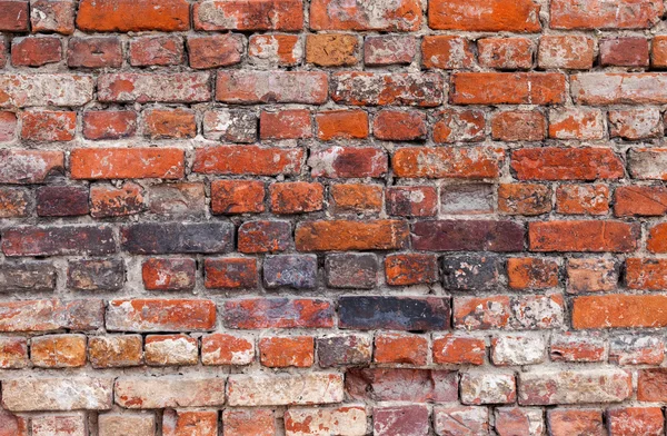 Verweerde gebeitst oude bakstenen muur als achtergrond — Stockfoto