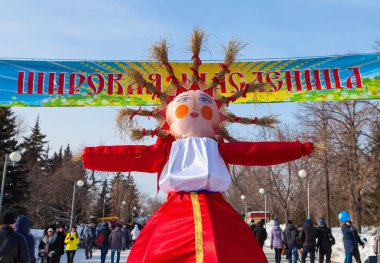 RUSSIA, SAMARA - March 2, 2014: Shrovetide in Russia. Big doll f clipart