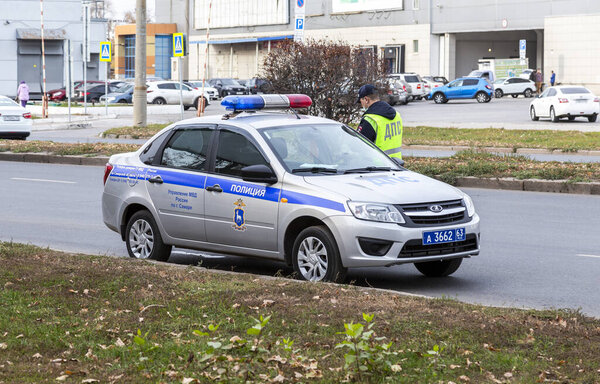 Samara, Russia - October 12, 2021: Russian police patrol cars of the State Automobile Inspectorate on the city street in summer day