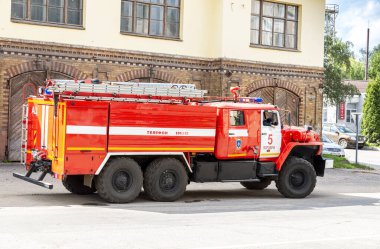 Borovichi, Russia - August 19, 2021: Red fire truck parked up on the city street