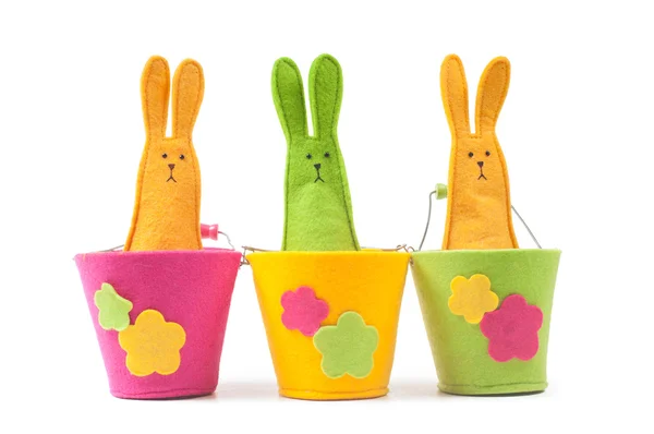 Multicolored easter bunnies sitting in row — Stock Photo, Image