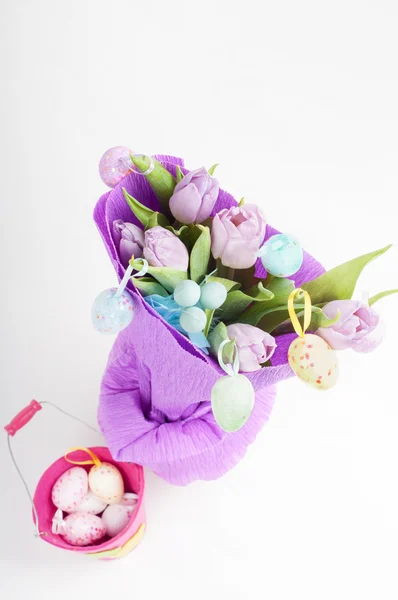 Easter eggs with bucket and tulips — Stock Photo, Image