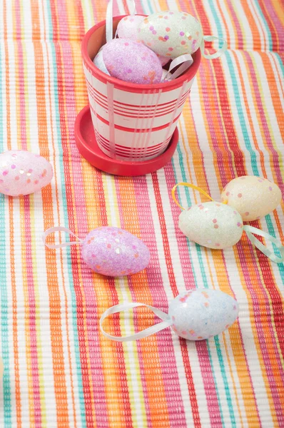 Easter eggs and striped napkin — Stock Photo, Image