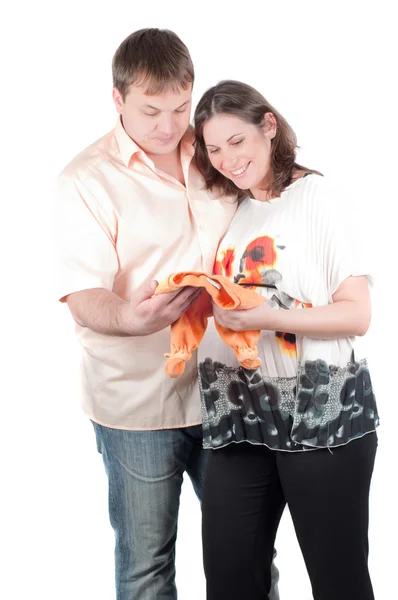 Expectant parents with baby clothes — Stock Photo, Image