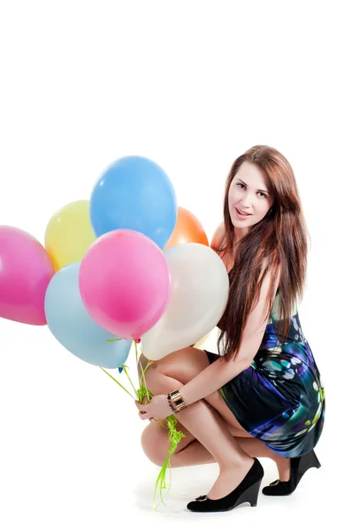 Beautiful female keeping multicolored air balloons — Stock Photo, Image