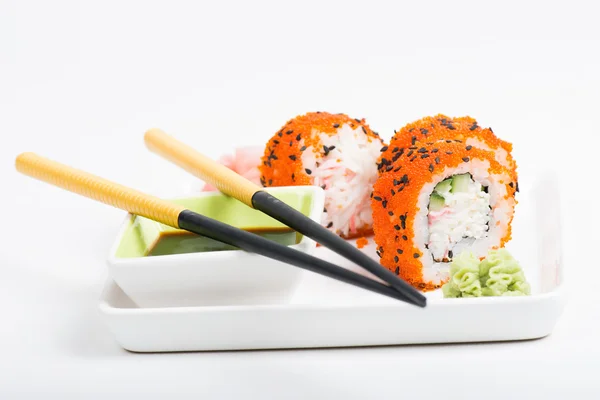 Rolls on the plate with chopsticks — Stock Photo, Image