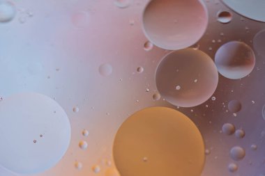 Turuncu ve gri arkaplan resmi yağ, su ve sabundan yapıldı