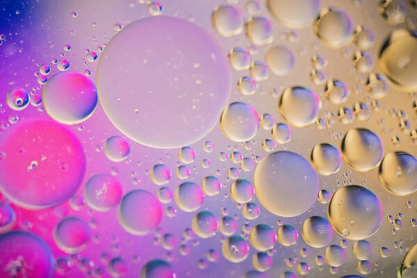 Oil drops in water. Abstract psychedelic pattern image multicolored. Abstract background with colorful gradient colors. Dof.