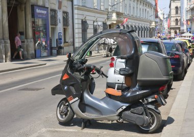 Scooter C1 (BMW) on the streets of Vienna. Austria  clipart